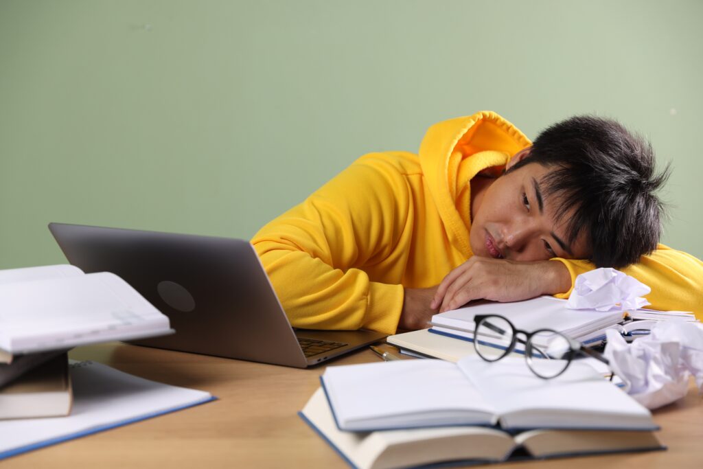 Tired female doctor staring at her screen while working at night